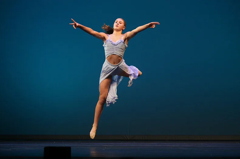 Kansas City team member Addison Yamnitz leaps during her solo performance in the dance competition.