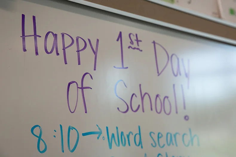 The first day of school for most Shawnee Mission students was Wednesday, Aug. 12. Above, a teacher's warm welcome back to students on the whiteboard reads "Happy 1st Day of School!" Photo credit Juliana Garcia.