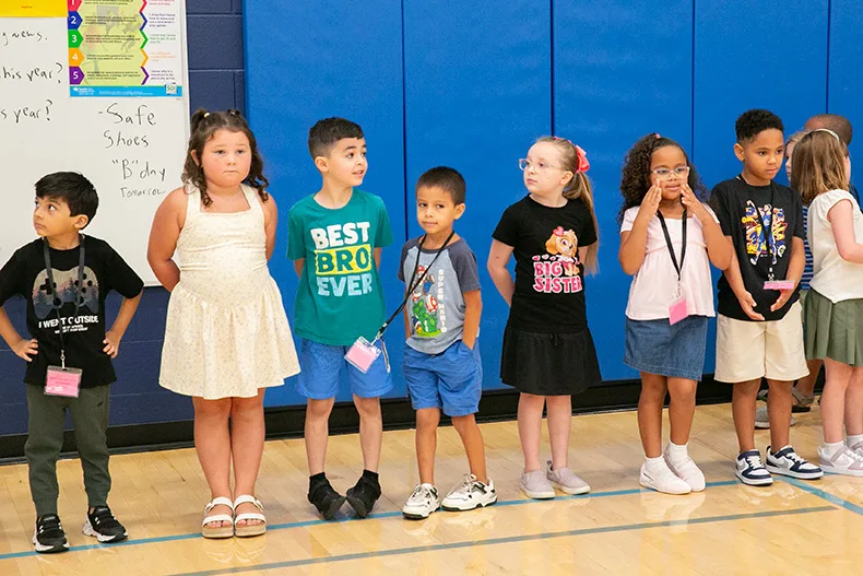 First grade Panthers at Pawnee patiently wait for the next Simon Says directive on the first day of school. Photo credit Juliana Garcia.