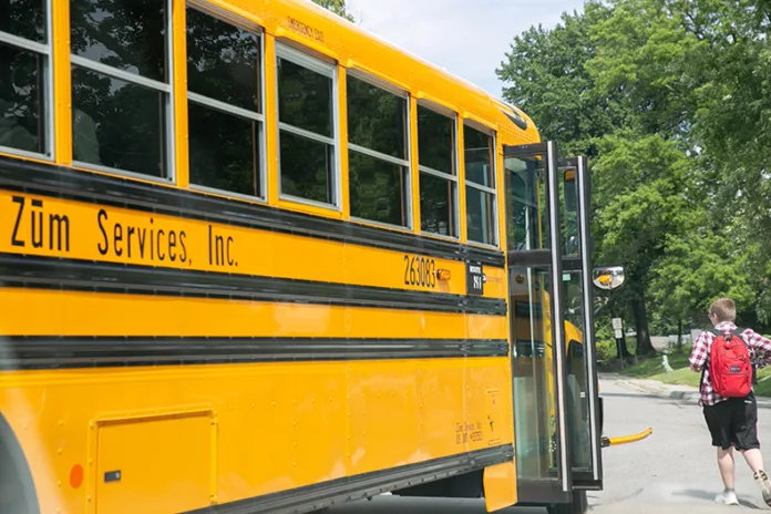 Shawnee Mission high school students are dropped off at their bus stop after school on Aug. 19. Photo credit Juliana Garcia.