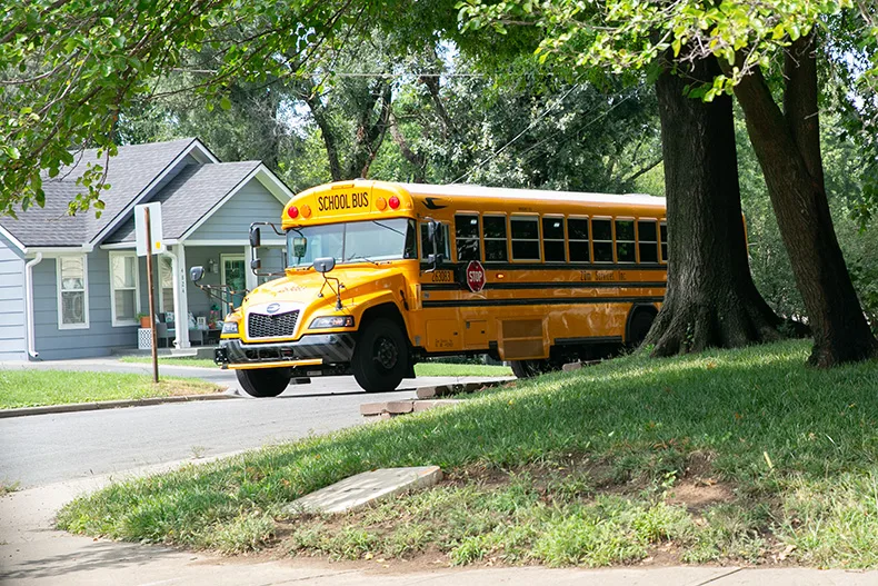 A Zum bus in Roeland Park arrives at a bus stop for high school students after school. Photo credit Juliana Garcia.