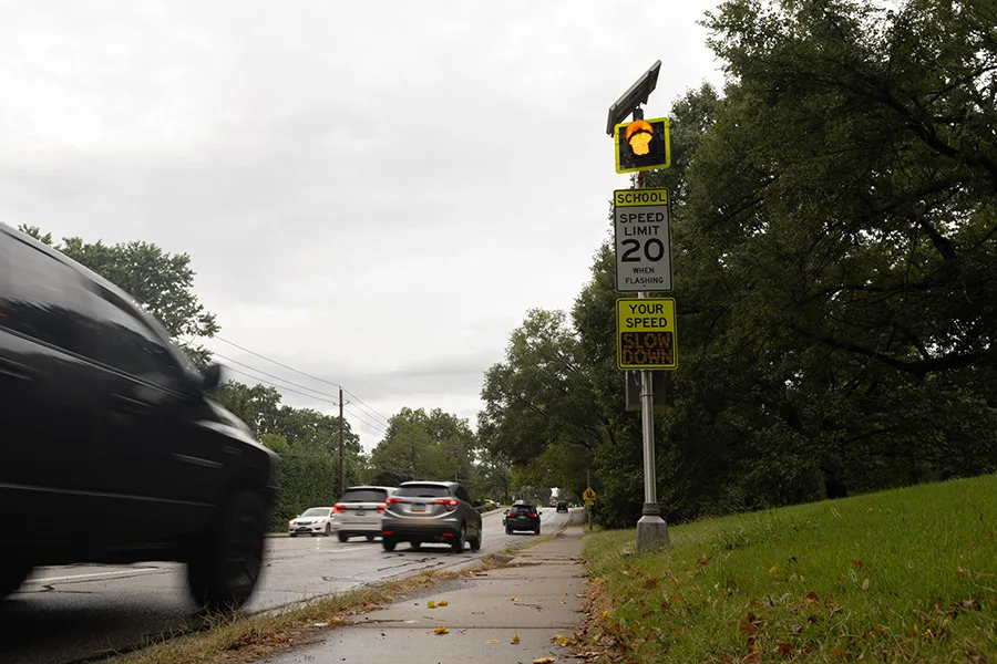 Cars drive west down 103rd Street by Brookwood Elementary on Thursday, Sept. 10.