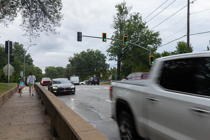 Pedestrians walk east down 103rd Street outside of Brookwood Elementary School on Thursday morning.