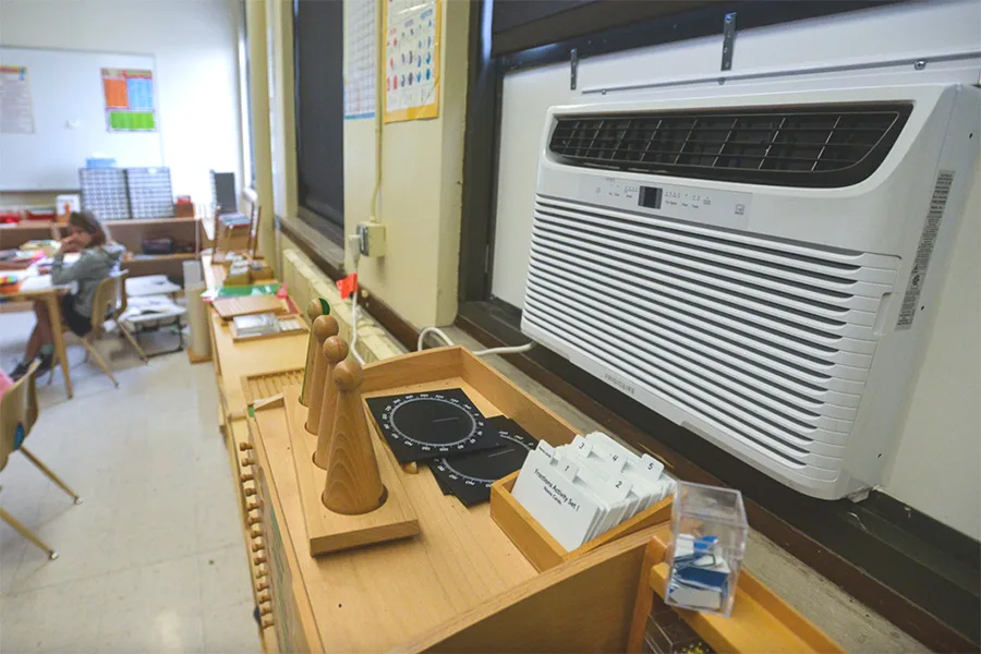 A student walks in spring 2025 in a hallway at Border Star Montessori, where the HVAC system was a mix of window units and other post-construction modifications. A district spokesperson said Border Star Montessori received new HVAC upgrades this summer.