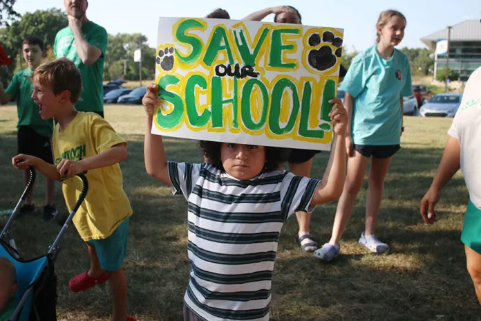 Six-year-old Max Martinez-Ramirez participates in a rally to support East Antioch Elementary Sept. 1. He's the seventh child in his family to attend the school.
