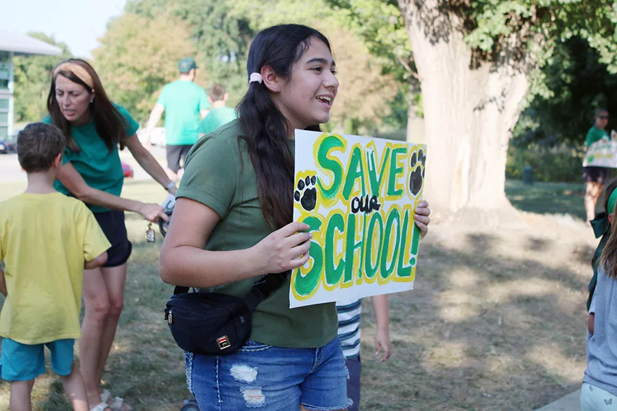 Hocker Grove student Sofia Martinez-Ramirez, 12, shows support for East Antioch, the elementary school she attended, during a rally Sept. 1.