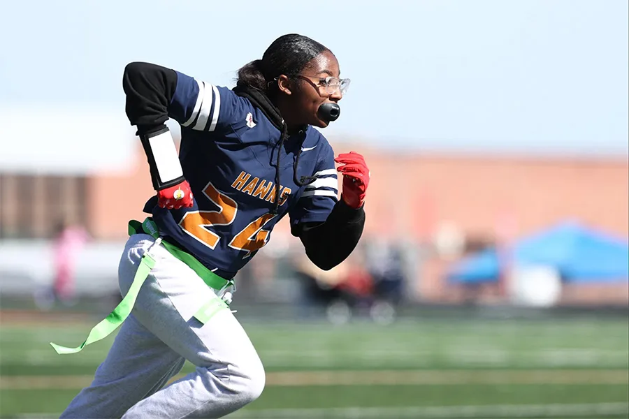 A student plays flag football in Kansas at Olathe East High School in 2024.
