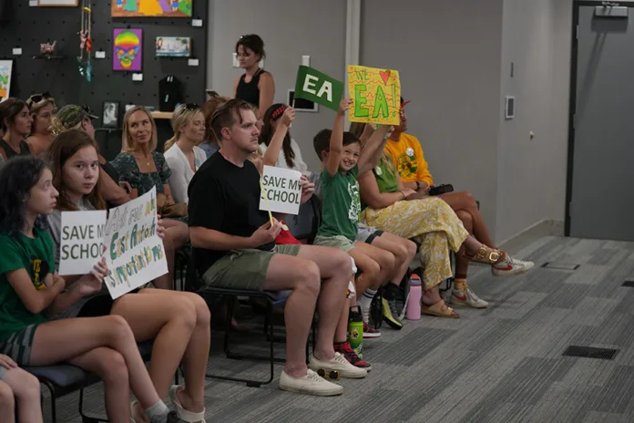 Members of the East Antioch community showed up in support of the school, with many wearing schools shirts and carrying signs celebrating the school and urging against its closure.