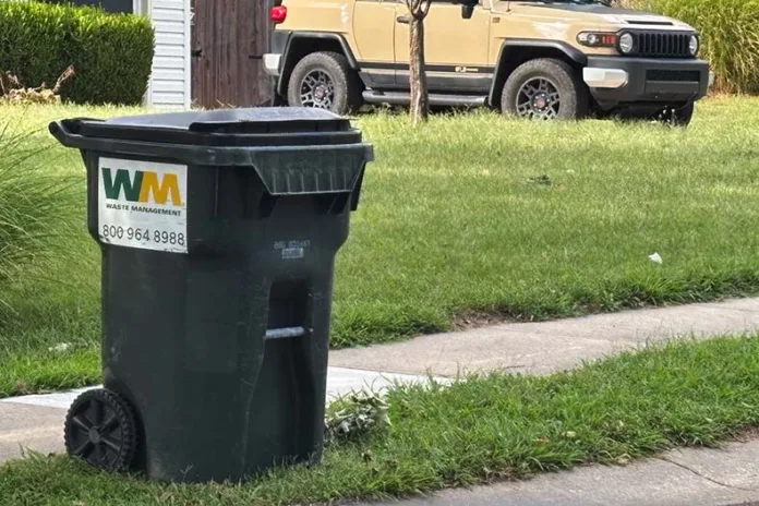A trash bin placed near the street in a northern Overland Park neighborhood ahead of trash pickup day.
