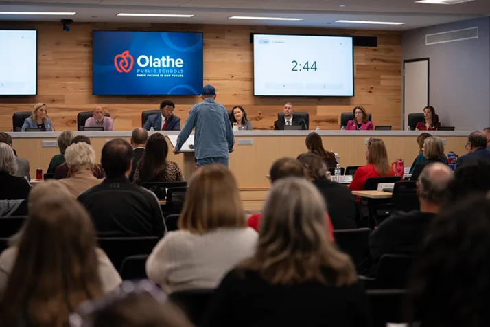 Walnut Grove parent Tony Hanna address the Olathe Board of Education Thursday night, asking them to delay the decision to close six schools. Photo credit Margaret Mellott.