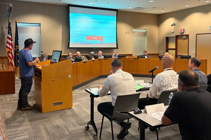 Parent Jesse Sloan address the Gardner Edgerton Board of Education Monday night, expressing concerns for how last month's revenue-neutral vote happened. Photo credit Margaret Mellott.