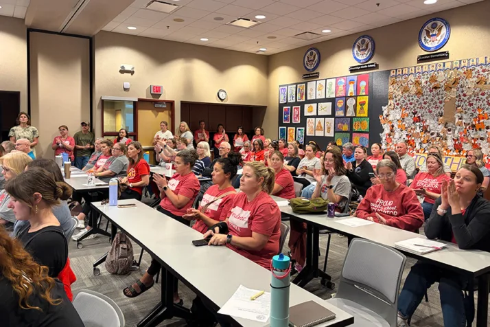 Teachers, parents and community members filled the Gardner Edgerton Board of Education room Monday night to hear an update on the $1.9 million in necessary budget cuts. Photo credit Margaret Mellott.