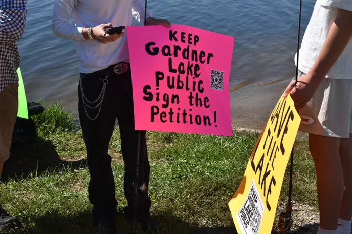 Lake users gathered Oct. 3 to spread awareness of a petition to keep Gardner Lake public.