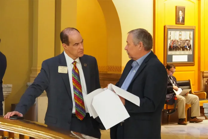 Steven Johnson (left) is running to retain his position as Kansas state treasurer.