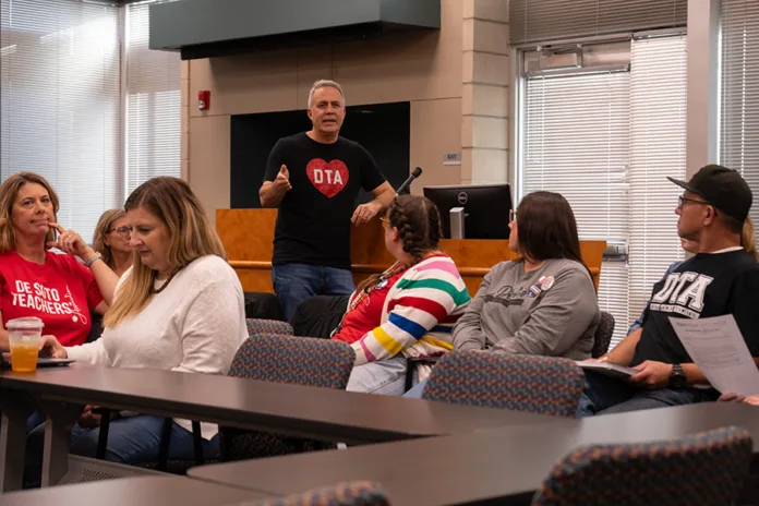 De Soto Teachers Association Lead Negotiator Jeff Wieland address a room filled with teachers during the Oct. 20 negotiations meeting. Photo credit Margaret Mellott.