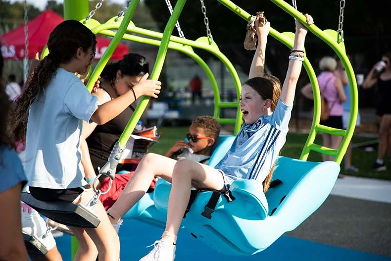 Kids of all ages celebrated the opening of Brody's Boundless Playground at the Blue Valley Rec Complex in Overland Park on Tuesday. Named for Brody Rea, a boy who has special needs, the playground is designed to be inclusive for all children.