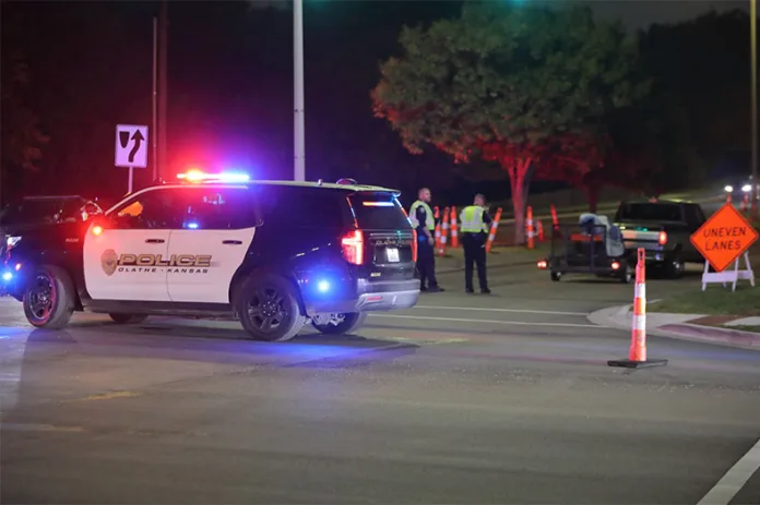 Olathe Police units on the scene after a pickup truck driver hit a teenager on a bike at 135th Street and Blackfoot Drive. Photo credit Mike Frizzell.