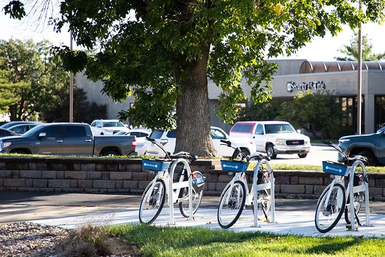 E-bikes sit on Metcalf Avenue in Overland Park.