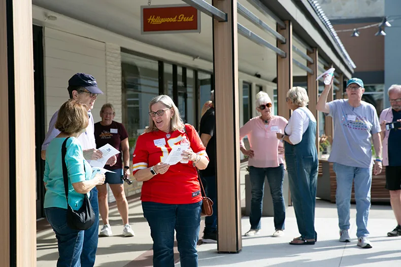 People who attended the walking tour received a small map of the Shops of Prairie Village with the names and locations of former restaurants and stores. Photo credit Juliana Garcia. 