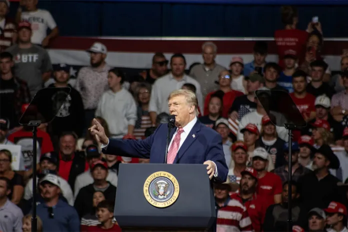 President Donald Trump speaking to the crowd near Wichita. Photo credit Roger Nomer/Kansas News Service.